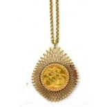 A George V full sovereign 1912, in pierced yellow metal frame on 9ct yellow gold chain approx 20.4g.