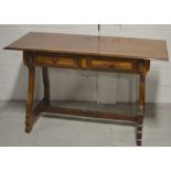 A South American hardwood two-drawer sideboard/table, width 129cm.