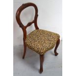 A reproduction balloon back children's chair, upholstered in leopard skin fabric.
