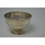 A hallmarked silver bowl on pedestal base with gadrooned decoration, diameter 21cm,