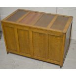 A 20th century oak panelled blanket box on castors, width 92cm.