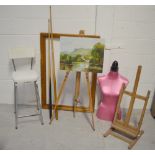 A collectors' lot comprising two artists' easels, a pink half-mannequin, decorative pictures,