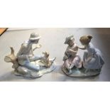 Two Nao figures; two young girls with a baby and a young boy playing with a dog (2).