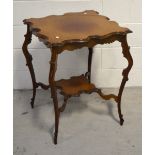 An Edwardian mahogany parlour table with shaped top inlaid with satinwood,