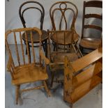 A farmhouse style ladder back rocking chair, two bentwood chairs,