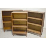 Three 20th century open bookcases of simple form, the largest two are oak examples,