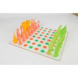 A plastic Karim Rashid chess set and board, boxed.