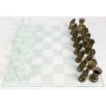 A 20th century Czech Republic "President" brown and clear glass chess set and board,