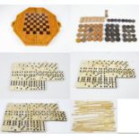 A set of bone and ebony dominoes, a similar boxed set, a set by St George Series,