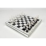 A 20th century crystal glass chess set and board, boxed.