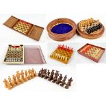 A 20th century French leather travelling chess set with plastic pieces,