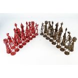 A set of 20th century Geoffrey Parker Medieval style metal skeletal chess pieces,