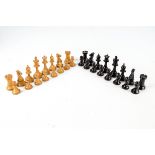 A set of 20th century Staunton pattern boxwood weighted chess pieces, height of king 8.5cm.