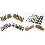 A figural metal heraldic style chess set, height of king 8.