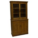 A late 19th century pine side cabinet with glazed upper section and cupboards beneath, width 119cm.