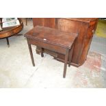 A dark mahogany foldover tea table of plain form with squared legs, width 75.5cm.