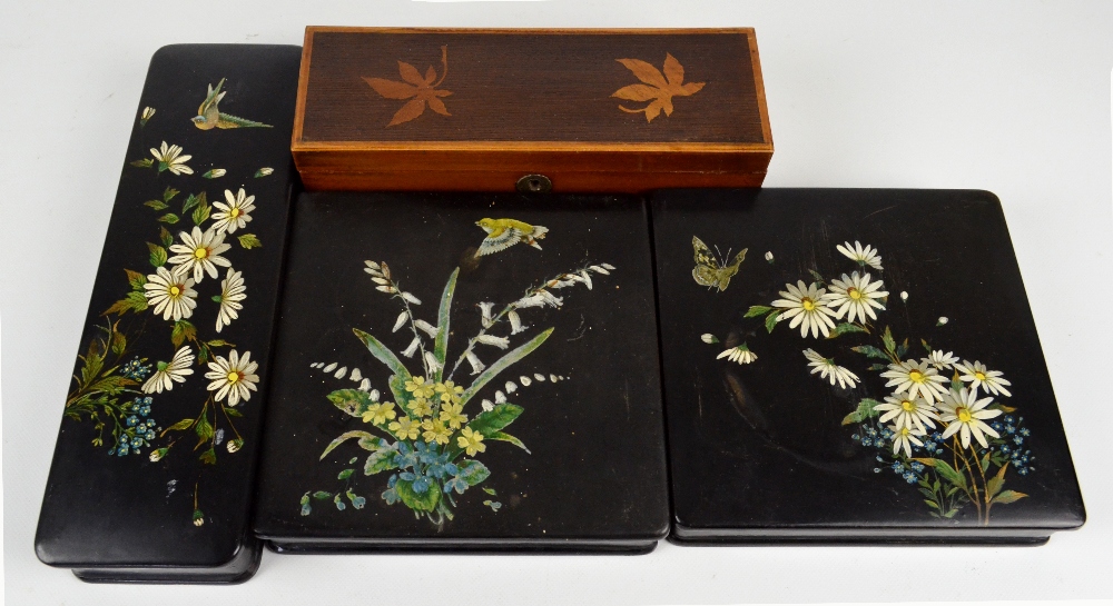 Two papier-mâché handkerchief boxes with removable lids decorated with flowers, birds,