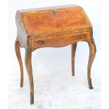 A reproduction French bureau de dame of bombé outline raised on square section cabriole legs with