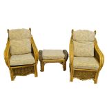 A rattan six piece conservatory suite, comprising two seater sofa, pair of chairs,