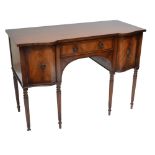 A reproduction mahogany kneehole sideboard with central drawer flanked by two cupboard doors,