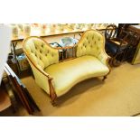 A Victorian mahogany framed double chair sofa with buttoned upholstered backs,