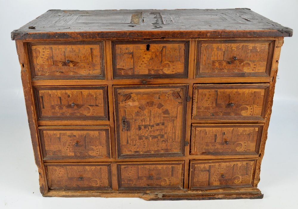 An 18th century Continental pine and inlaid travelling cabinet,