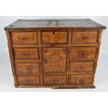 An 18th century Continental pine and inlaid travelling cabinet,