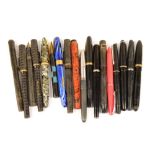 A group of vintage pens including a blue marbled body Wearever, a simulated wood finished example,