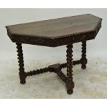 A 20th century carved oak console table with phoenix frieze decoration,