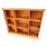 An Edwardian oak open bookcase with adjustable shelves and plinth base, width 160cm.