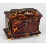 A 19th century tortoiseshell and ivory inlaid sarcophagus jewellery box with monogrammed "M"