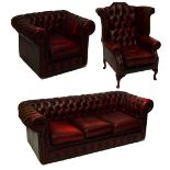 A buttoned red leather three seat Chesterfield sofa,