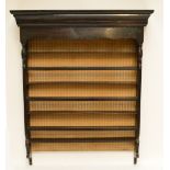 An antique oak wall mounted plate rack, width 101cm, height 124cm.