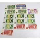 A small collection of British bank notes comprising ten £1 notes, a replacement example,