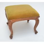 A Victorian bleached rosewood rectangular upholstered stool on four cabriole legs with scrolling