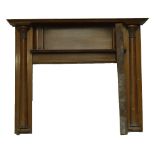 A mahogany fire surround with secondary mantel shelf, flanked by column mouldings, length 161cm,