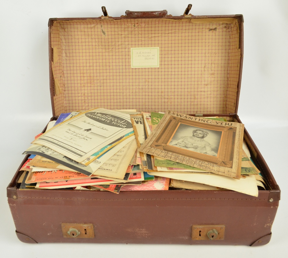 A very large collection of printed vintage sheet music contained within a suitcase.