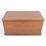 A c.1900 walnut rounded rectangular lidded box with compartmentalised interior, width 50cm.