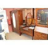 An early 20th century mahogany string inlaid dressing table with oval mirror and two small drawers