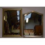 Two modern bevelled wall mirrors.