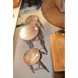 Three various stools with circular seats on four ring turned stretchered supports,