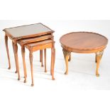 A nest of three shaped rectangular occasional tables with cabriole legs on pad feet,