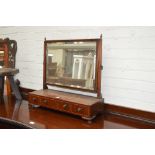 An early 19th century mahogany and line inlaid swing toilet mirror with three drawer base, width 68.