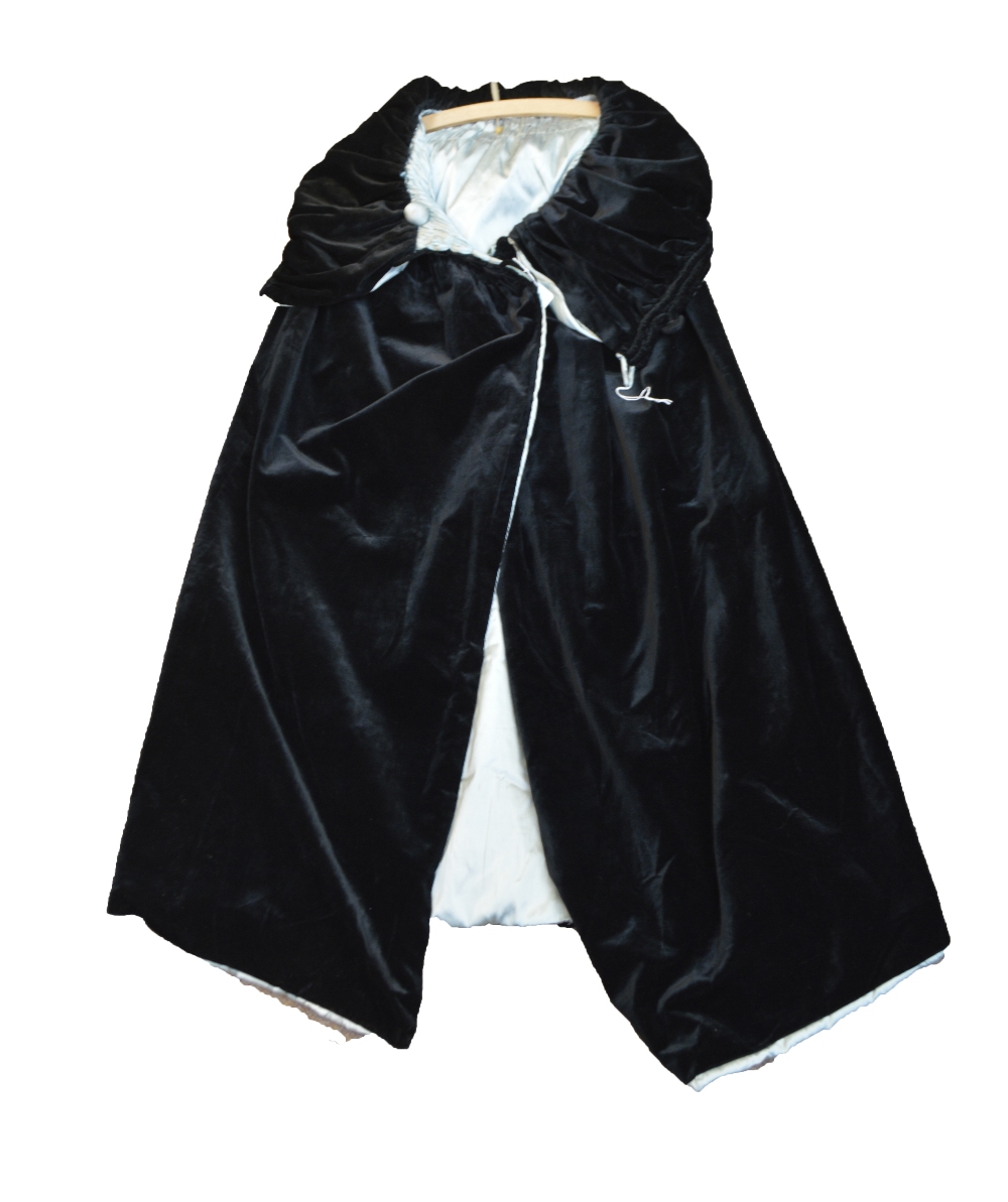 An Edwardian double sided lady's opera cloak in black velvet and aqua silk taffeta,