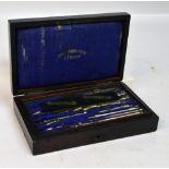 A set of draughtsman's instruments contained in a wooden string inlaid fitted box with hinged lid,