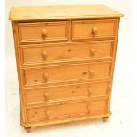 A modern pine chest of drawers, width 97cm, height 120cm.