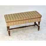 A Victorian walnut framed box seat duet stool, with padded top,