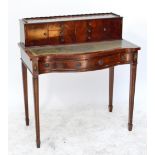 A reproduction mahogany lady's writing table with superstructure above lined top and two serpentine