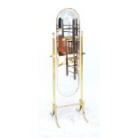 A brass framed domed cheval mirror on four outswept legs, height 154cm.