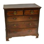 A George III oak and mahogany crossbanded chest of drawers,